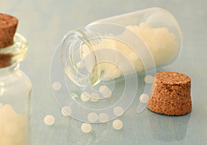 Homeopathic pills closed up in glass bottle