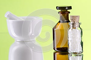 Homeopathic pills with glassbottle and mortar