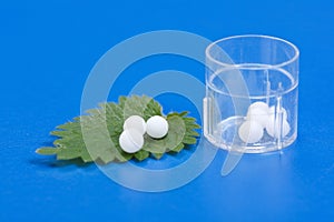 Homeopathic pills on Urtica Urens leaf