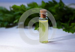 Homeopathy oil in vintage bottles on wood and green background.