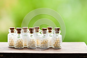 Homeopathy pills in vintage bottles photo