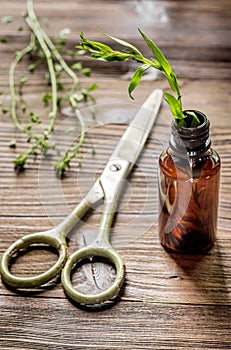 Homeopathy. Store up medicinal herbs. Herbs in glass on wooden table background