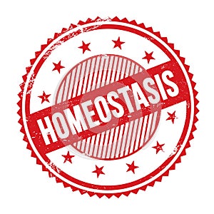 HOMEOSTASIS text written on red grungy round stamp photo