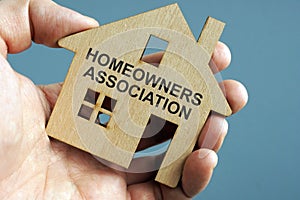 Homeowners Association HOA written on a model of home photo