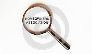 Homeowners Association on a sheet under a magnifying glass