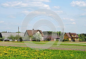 Homes and beautiful yellow field, Lithuania