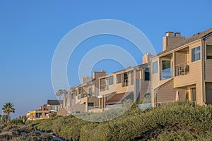 Homes on cliff overlooking beach at Del Mar Southern California on a sunny day