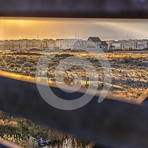 Homes in Daybreak Utah seen from bridge at sunset