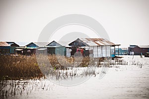 Homes on stilts on the floating village of Kampong Phluk, Tonle Sap lake, Siem Reap province, Cambodia