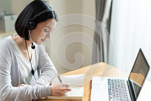 Homeschool Caucasian cute young girl student learning virtual internet online class from school teacher by remote meeting due to c