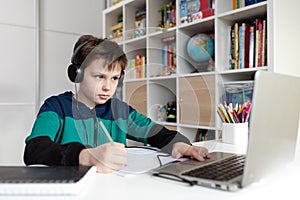 Homeschooled boy having online class