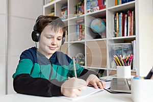 Homeschooled boy having online class