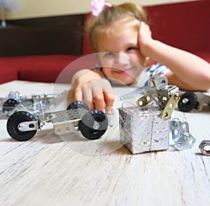 Homeschooling ,child designs,  Screw driver, nuts, wrench, bolts and parts of children`s metallic constructor. children`s metal