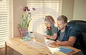 homeschooling and elearning. back to school. happy dad and son in glasses use laptop