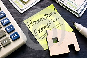 Homestead exemption written on the sticker and model of home. photo