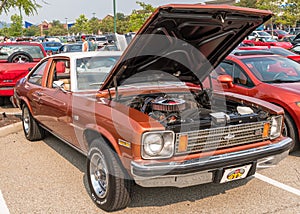 Homestead, Pennsylvania, USA July 21, 2021 A 1974 Chevrolet Nova coupe with it`s hood raised