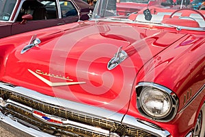 Homestead, Pennsylvania, USA July 21, 2021 Two silver hood ornaments on a vintage red Chevrolet convertible