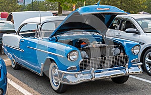 Homestead, Pennsylvania, USA July 21, 2021 A two toned blue and white 1955 Chevrolet Bel Air Coupe with it`s hood raised