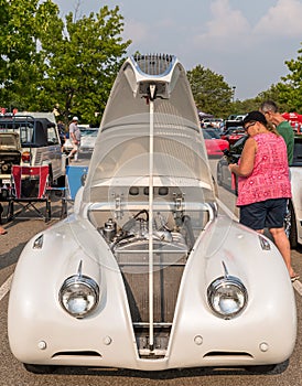 Homestead, Pennsylvania, USA July 21, 2021 A vintage white Jaguar with it`s hood open