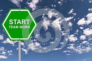 Start team work traffic sign on blue sky