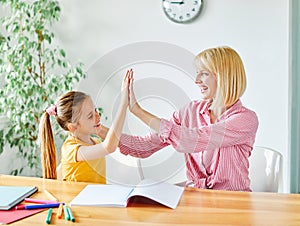 homework teaching education mother children daughter familiy childhood child teacher classroom school high five