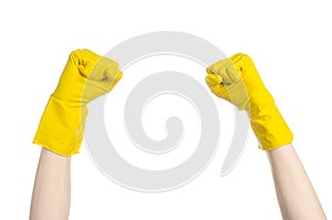 Homework, washing and cleaning of the theme: man's hand holding a yellow and wears rubber gloves for cleaning isolated on white ba