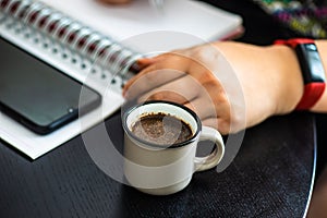 Homeworking concept with cup of coffee photo