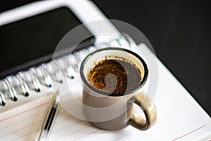 Homeworking concept with cup of coffee photo
