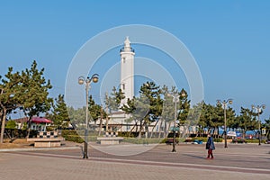 Homigot lighthouse at sunrise plaza park