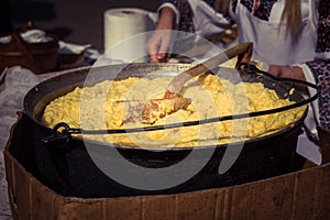 Hominy prepared in a caldron on fire