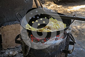 Hommade crisps on open fire in Mombasa Kenya