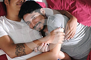 Homosexual Couple Hugging and Relaxing In Bed