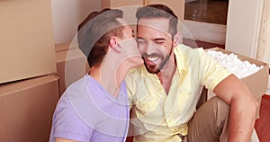 Homosexual couple speaking and laughing