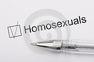 Homosexuals - checkbox with a cross on white paper with pen. Checklist concept