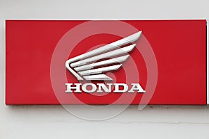 Honda motorcycle logo on a wall