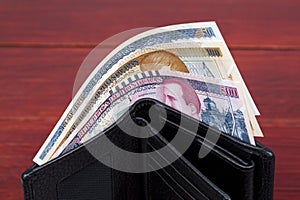 Honduran lempira in the black wallet photo