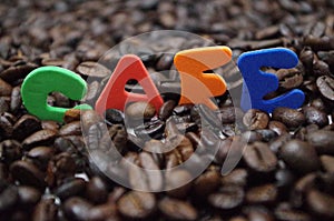 Honduras coffe beans on white surface with a cup of fresh brewed coffe name label 14