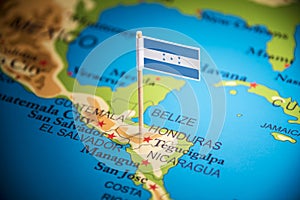 Honduras marked with a flag on the map photo