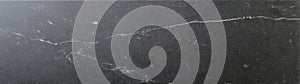 Honed dark gray soapstone with fine veining and subtle mineral pattern in flatlay format photo
