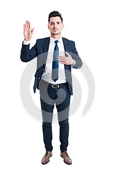 Honest lawyer hand on heart as swear or oath gesture