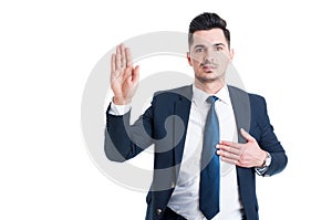Honest lawyer hand over heart as swear or oath gesture