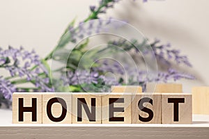 Honest from wooden letters on wooden background