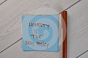 Honesty Is The Best Policy write on sticky notes isolated on Wooden Table