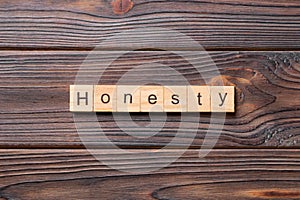 Honesty word written on wood block. honesty text on table, concept