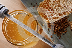 Honey background. Sweet honey in a glass jar