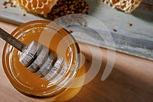 Honey background. Sweet honey in a glass jar