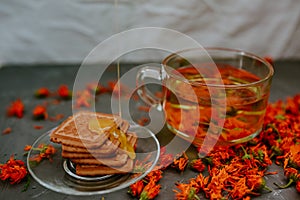 The honey on baked goods. Orange calendula flower tea