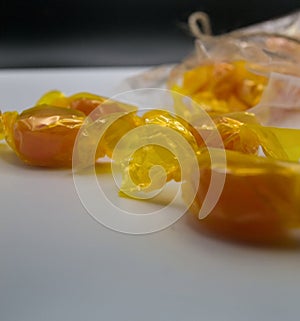 Honey candies on white background with soft light