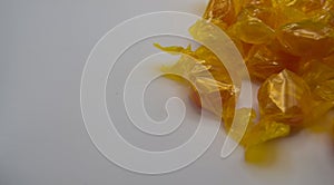 Honey candies on white background with soft light