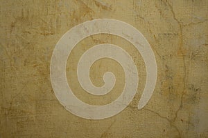 Honey colored cracked plaster wall